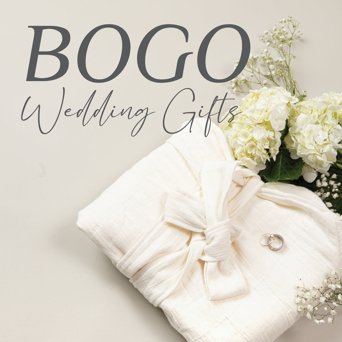 Image of a folded robe on an off-white background with rings and white flowers. A caption reading BOGO Wedding Gifts is at the top of the image.