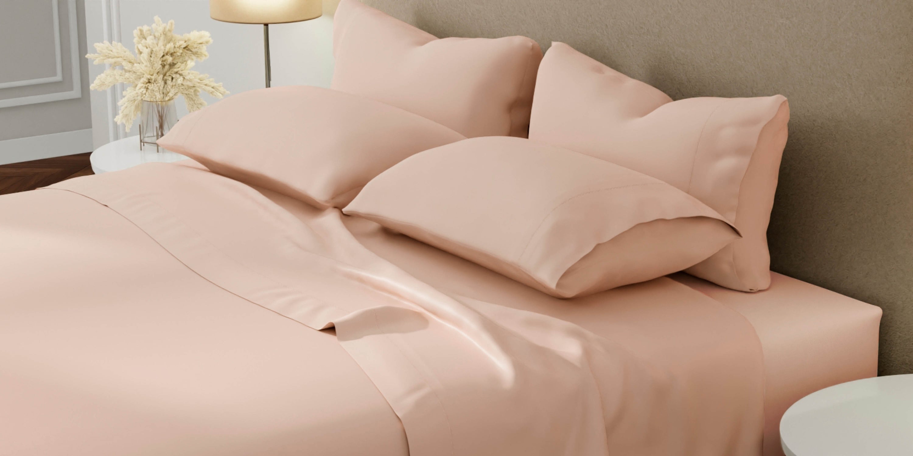 Side view image of a bed with Blush Pink Weightless Cotton Sheets and Pillowcases