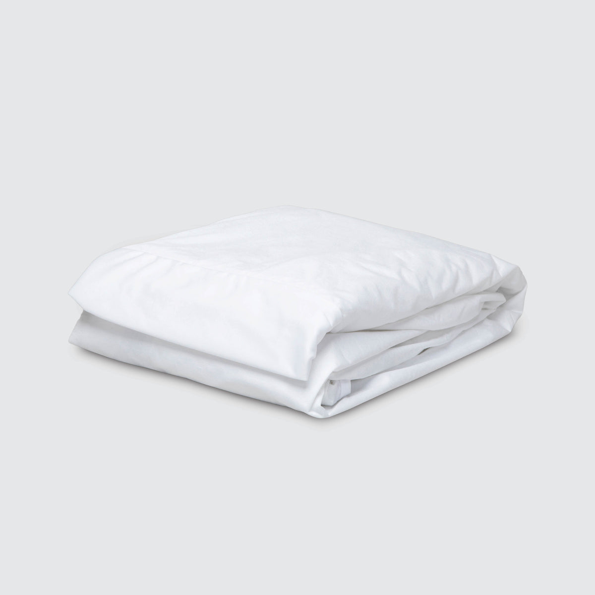 Image of a folded Bamboo Mattress Protector on a plain white background