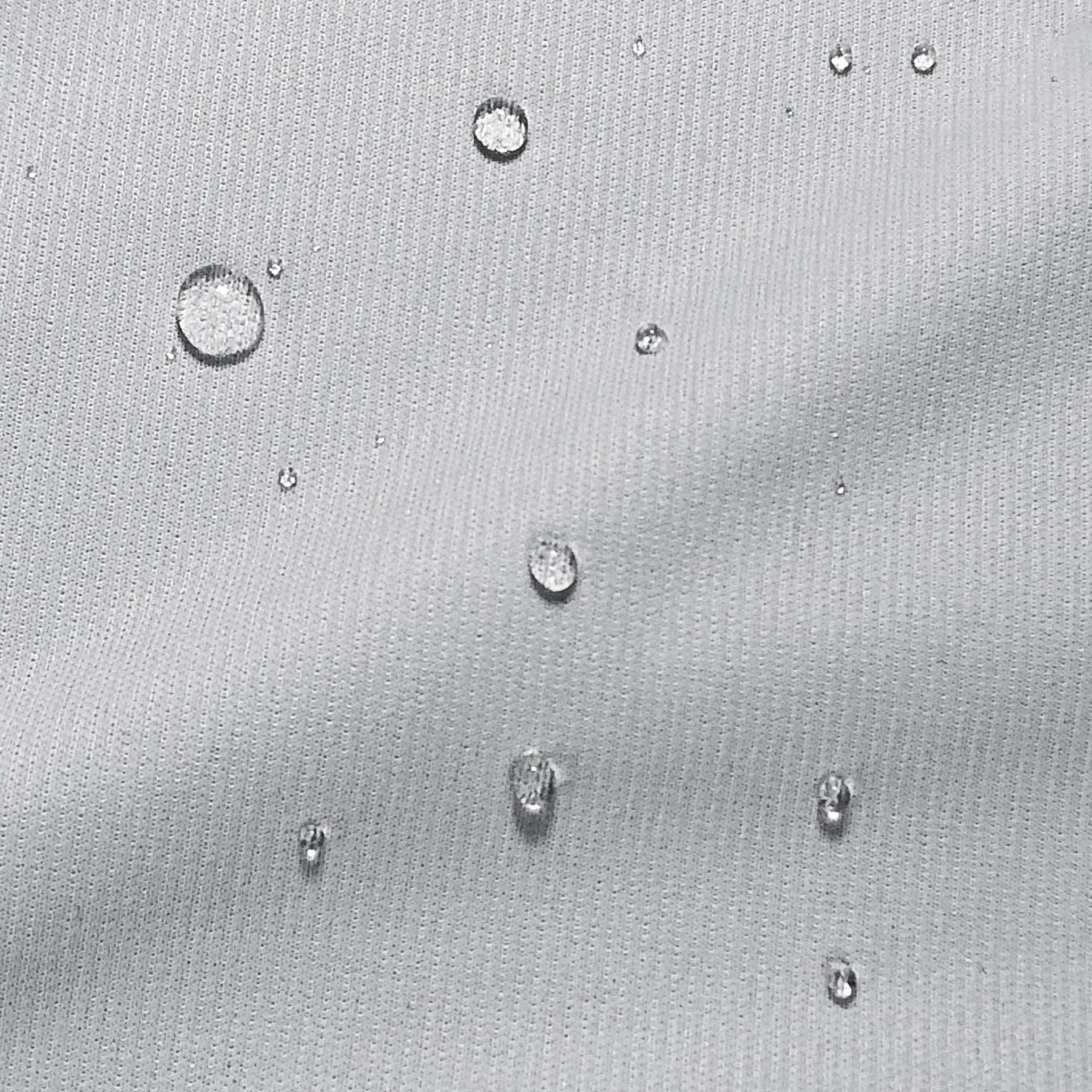 Image of water droplets on a mattress protector showcasing its resistance to moisture