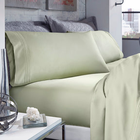 Image of Sage Recovery Cotton Sheets on a bed