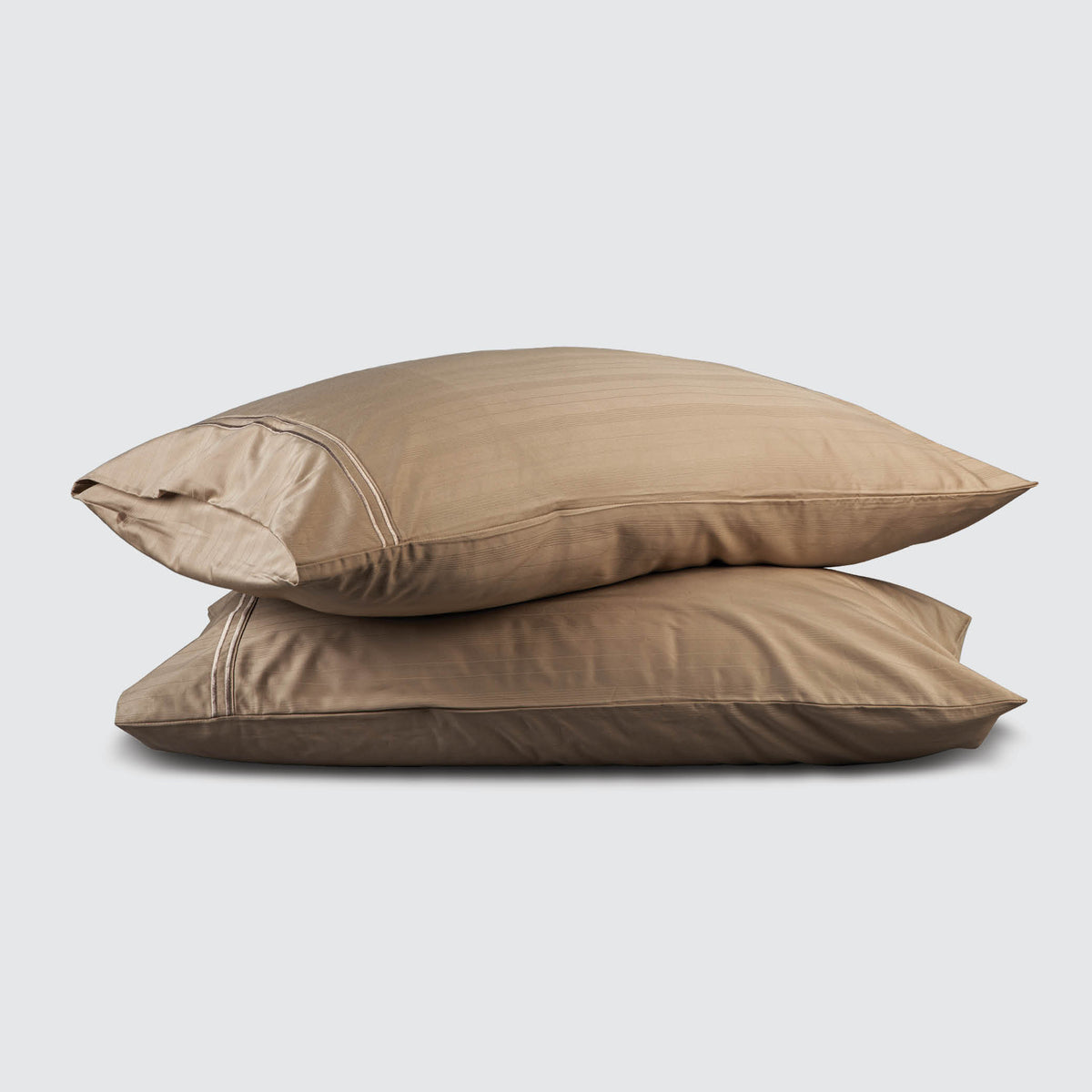 Image of two pillows stacked on top of one another with a Sand Bamboo Rayon Pillowcase on each