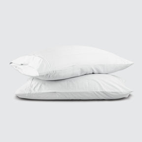 Image of two pillows stacked on top of one another with a White Bamboo Rayon Pillowcase on each