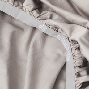 Image showcasing the Precision-Fit® elastic band on the bottom of a Dove Gray Bamboo Rayon fitted sheet