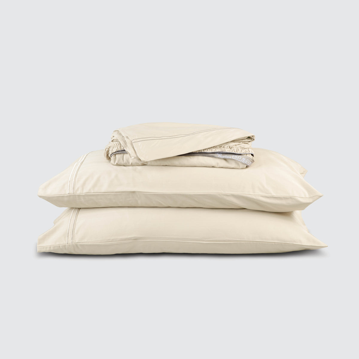 Image of Ivory Bamboo Rayon Sheet Set stacked top to bottom: Flat Sheet, Fitted Sheet, 2 Pillowcases