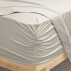 Image of a corner of an Ivory Bamboo Rayon fitted sheet showcasing the Precision-Fit® Corner