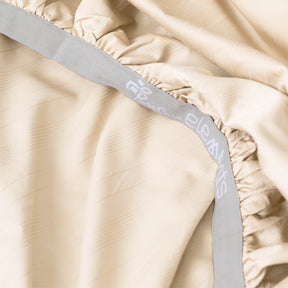 Image showcasing the Precision-Fit® elastic band on the bottom of an Ivory Bamboo Rayon fitted sheet