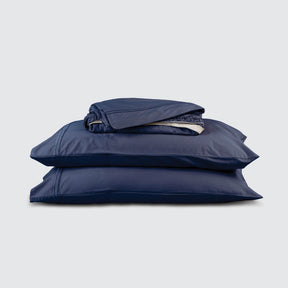 Image of Midnight Bamboo Rayon Sheet Set stacked top to bottom: Flat Sheet, Fitted Sheet, 2 Pillowcases