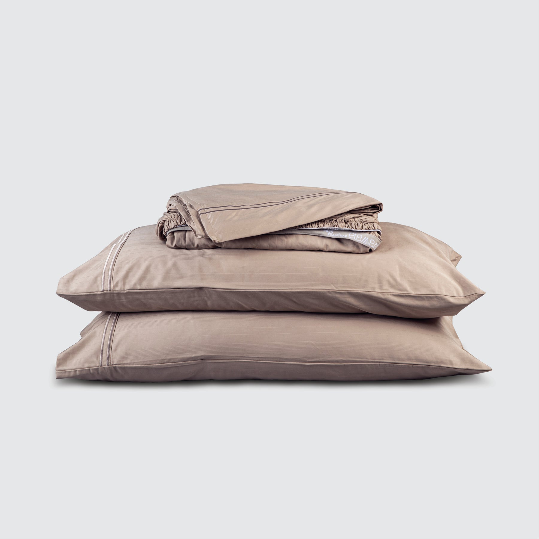 Image of Sand Bamboo Rayon Sheet Set stacked top to bottom: Flat Sheet, Fitted Sheet, 2 Pillowcases