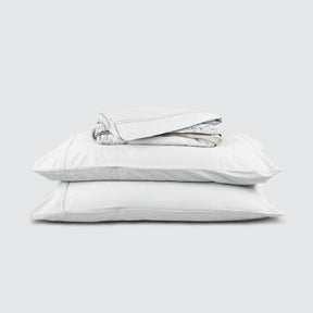 Image of White Bamboo Rayon Sheet Set stacked top to bottom: Flat Sheet, Fitted Sheet, 2 Pillowcases