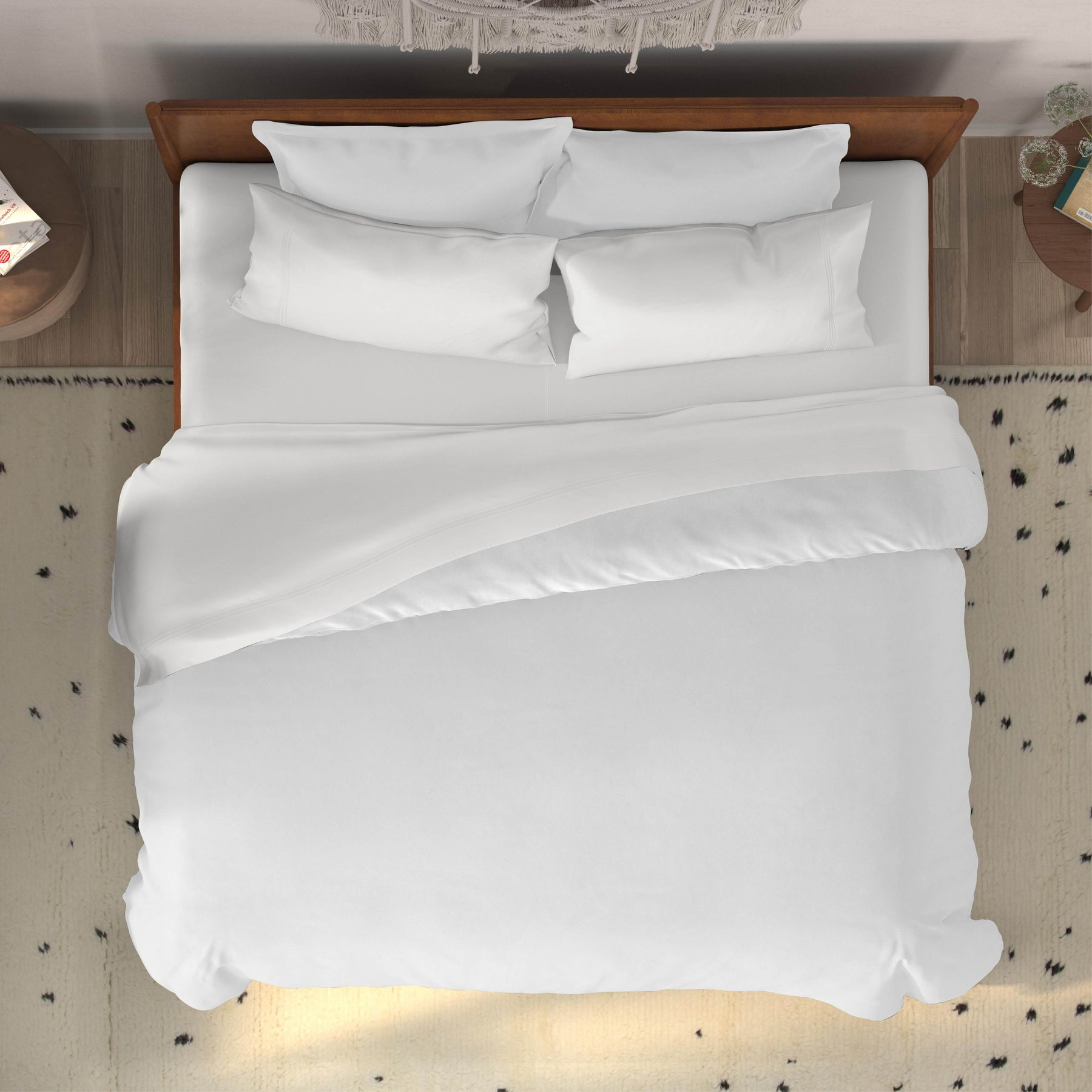 Top-down image of a dressed bed with White Bamboo Rayon Sheets and a white duvet cover 