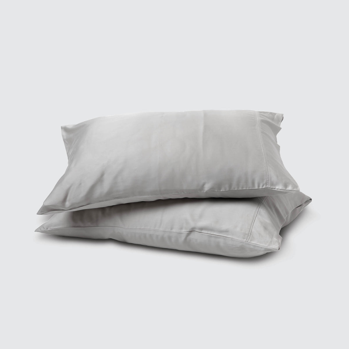 Image of two pillows stacked on top of one another with a Dove Gray Recovery Viscose Pillowcase on each