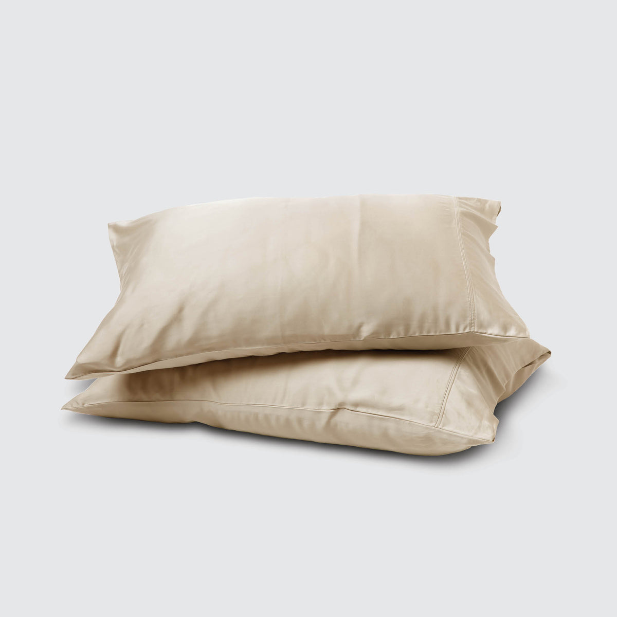 Image of two pillows stacked on top of one another with an Ivory Recovery Viscose Pillowcase on each