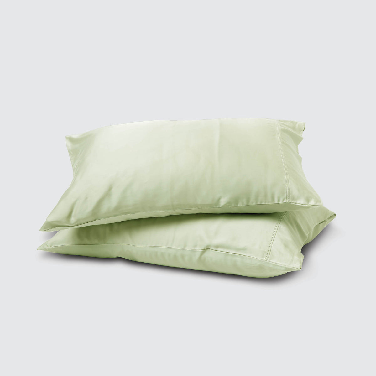 Image of two pillows stacked on top of one another with a Sage Recovery Viscose Pillowcase on each