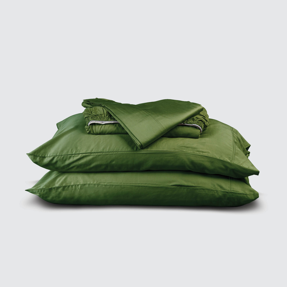 Image of Moss Recovery Viscose Sheet Set stacked top to bottom: Flat Sheet, Fitted Sheet, 2 Pillowcases