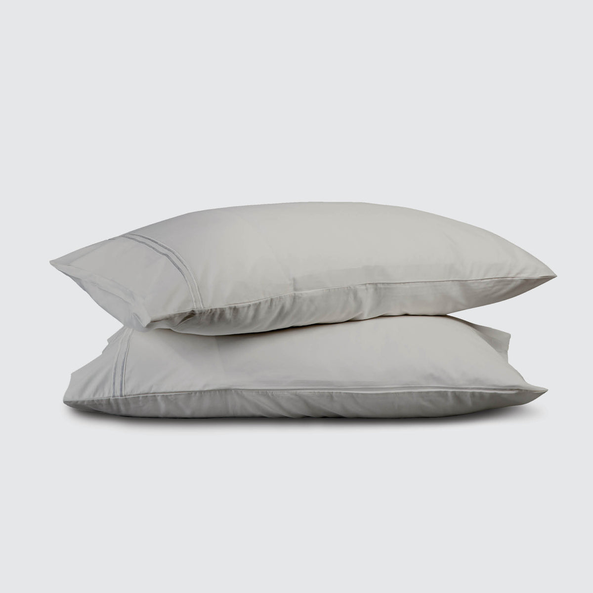 Image of two pillows stacked on top of one another with a Dove Gray Refreshing TENCEL™ Lyocell Pillowcase on each