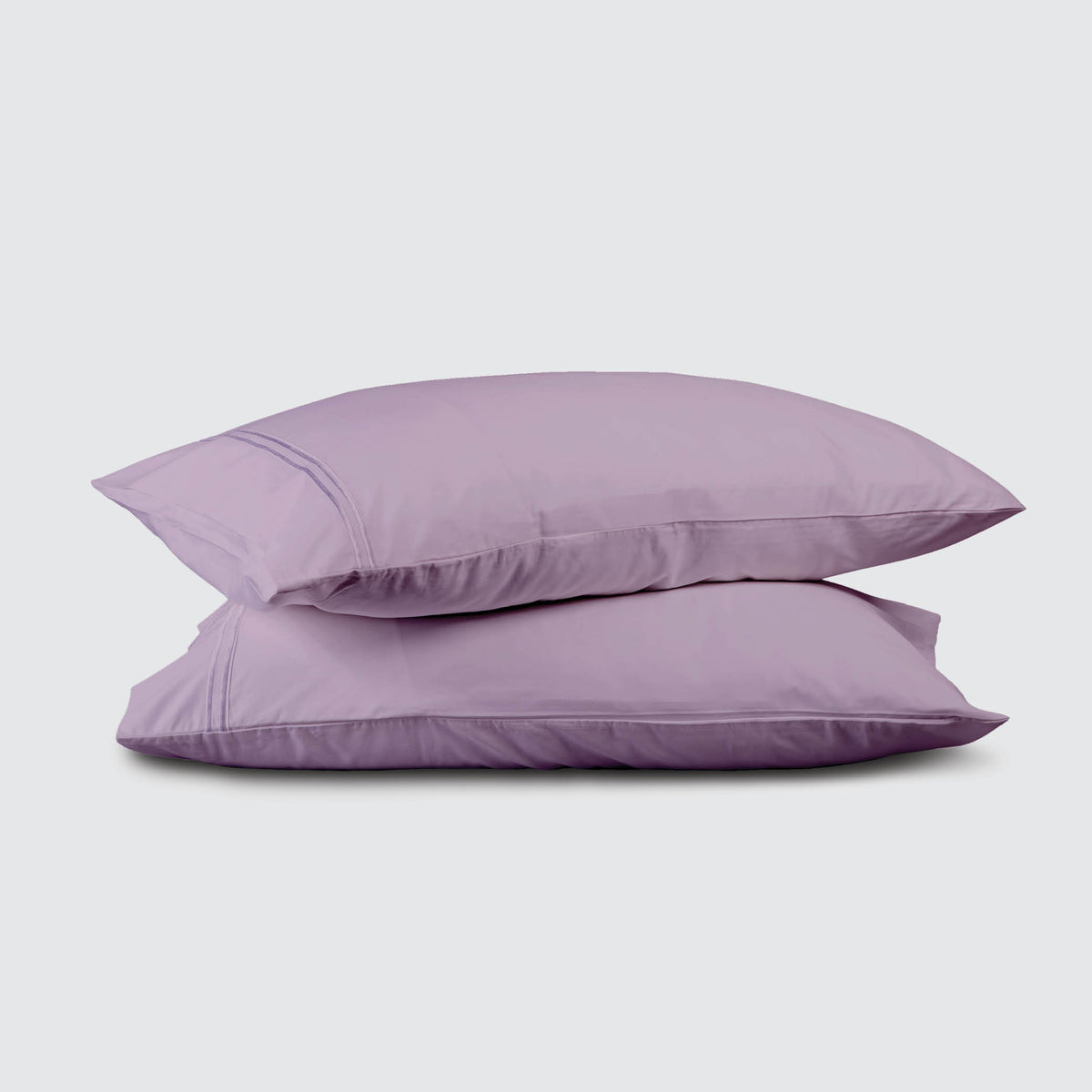 Image of two pillows stacked on top of one another with a Lilac Refreshing TENCEL™ Lyocell Pillowcase on each