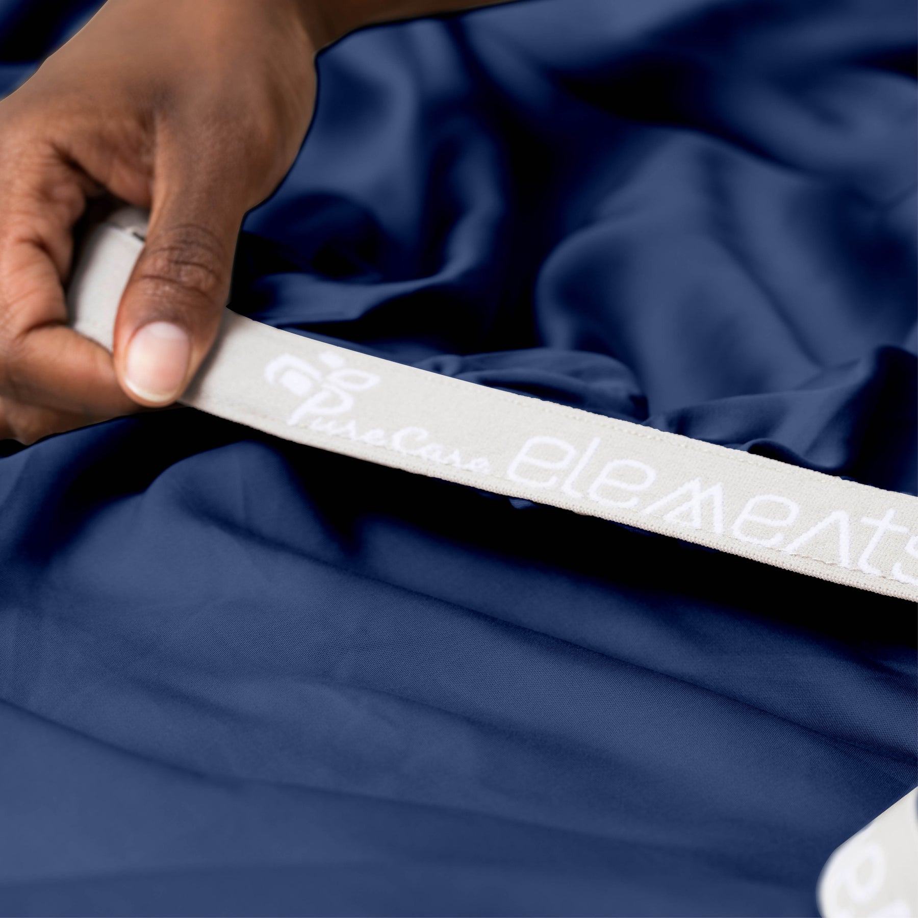 Image showcasing the Precision-Fit® elastic band on the bottom of a Celestial Blue Refreshing TENCEL™ Lyocell fitted sheet