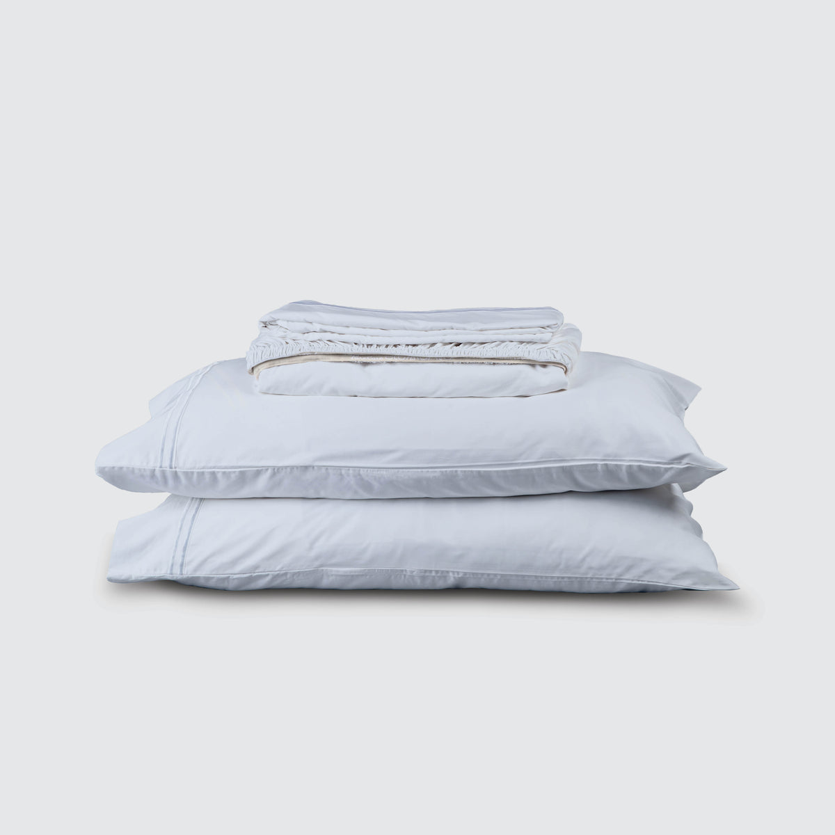 Image of Light Blue Refreshing TENCEL™ Lyocell Sheet Set stacked top to bottom: Flat Sheet, Fitted Sheet, 2 Pillowcases