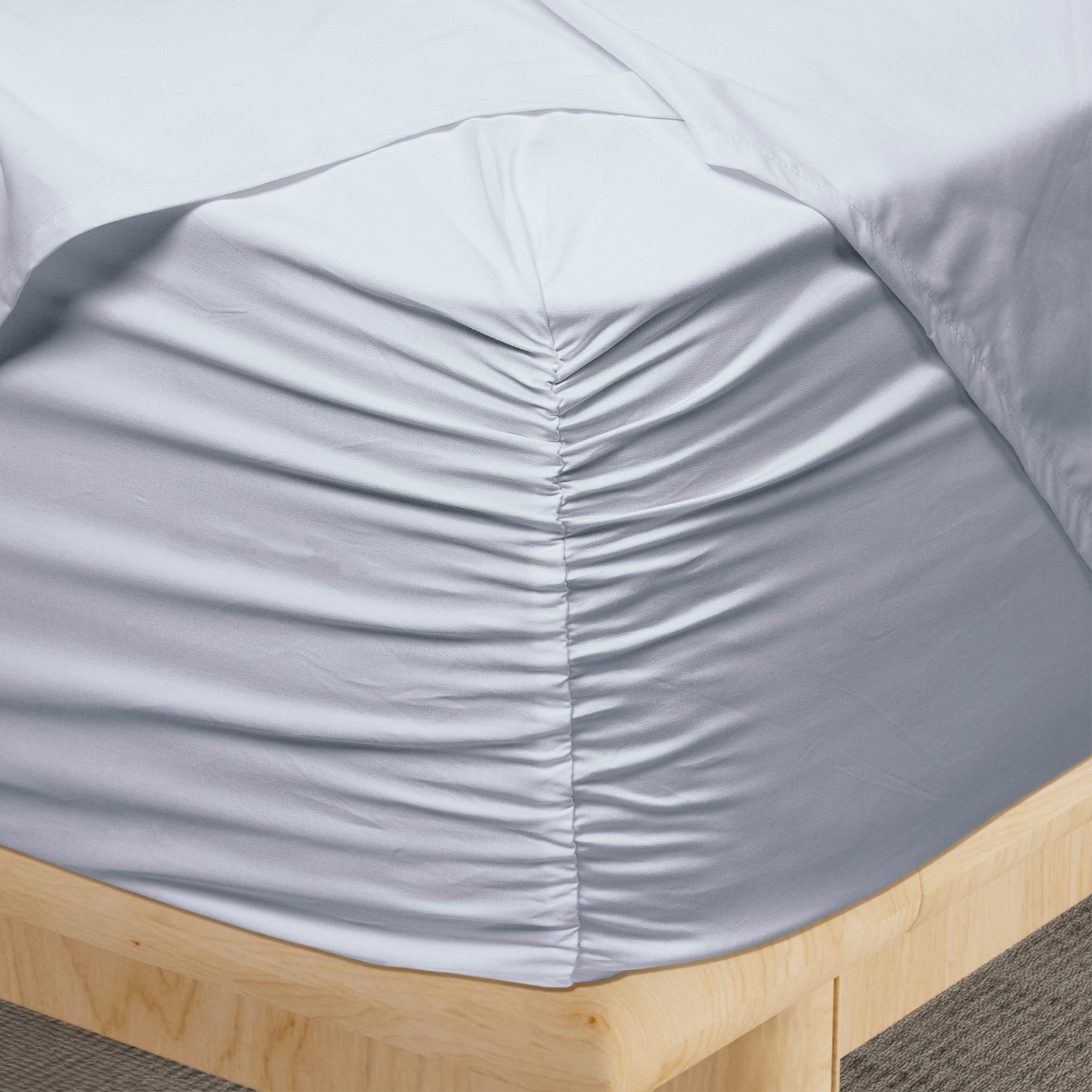 Image of a corner of a Light Blue Refreshing TENCEL™ Lyocell fitted sheet showcasing the Precision-Fit® Corner