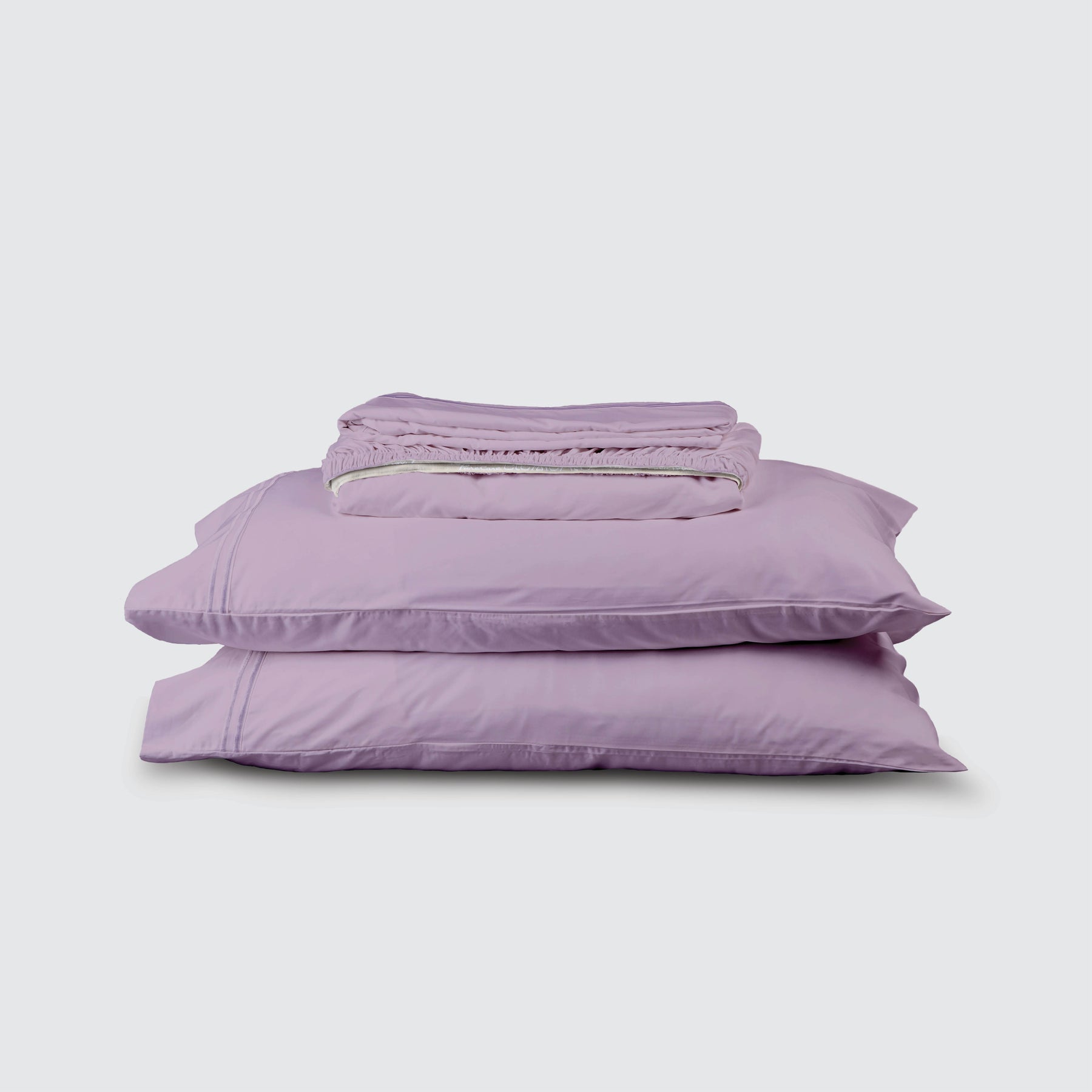 Image of Lilac Refreshing TENCEL™ Lyocell Sheet Set stacked top to bottom: Flat Sheet, Fitted Sheet, 2 Pillowcases