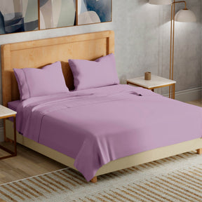 Image of a bedroom with a dressed bed with Lilac Refreshing TENCEL™ Lyocell Sheets 