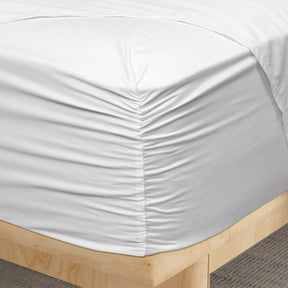 Image of a corner of a White Refreshing TENCEL™ Lyocell fitted sheet showcasing the Precision-Fit® Corner