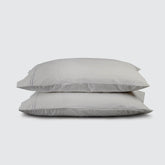 Image of two pillows stacked on top of one another with a Dove Gray Soft Touch TENCEL™ Modal Pillowcase on each