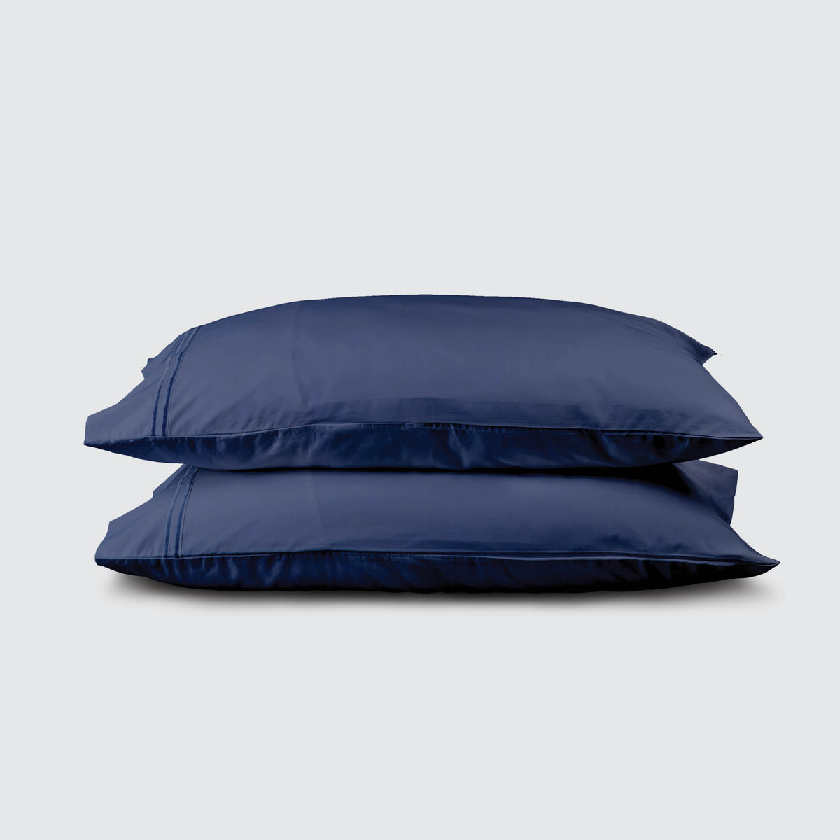 Image of two pillows stacked on top of one another with a Midnight Soft Touch TENCEL™ Modal Pillowcase on each