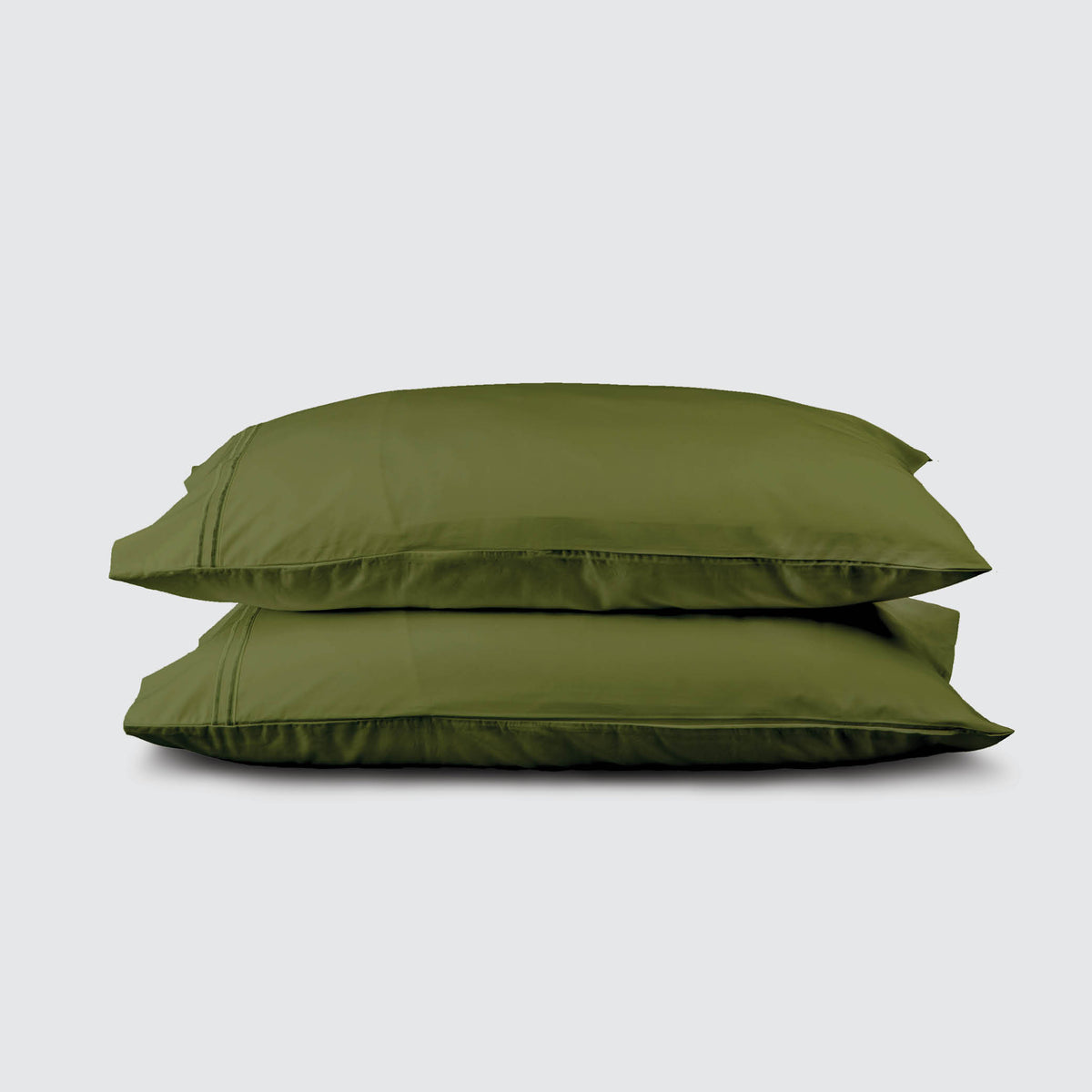 Image of two pillows stacked on top of one another with a Moss Soft Touch TENCEL™ Modal Pillowcase on each