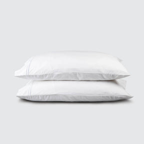 Image of two pillows stacked on top of one another with a White Soft Touch TENCEL™ Modal Pillowcase on each