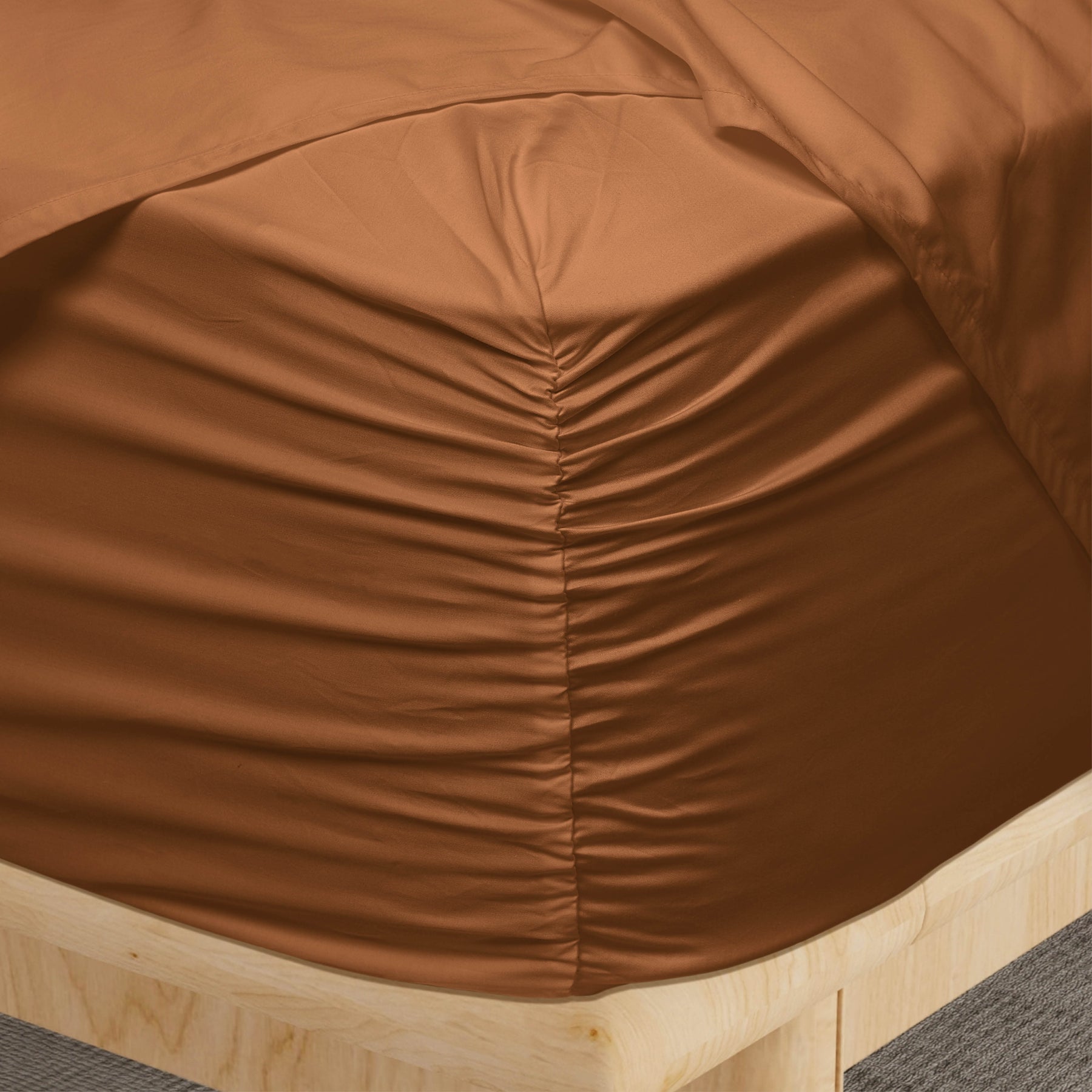 Image of a corner of a Clay Soft Touch TENCEL™ Modal fitted sheet showcasing the Precision-Fit® Corner