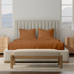 Image of a bedroom with a dressed bed with Clay Soft Touch TENCEL™ Modal Sheets