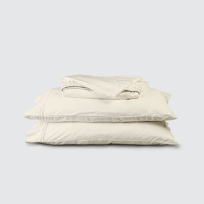 Image of Ivory Soft Touch TENCEL™ Modal Sheet Set stacked top to bottom: Flat Sheet, Fitted Sheet, 2 Pillowcases