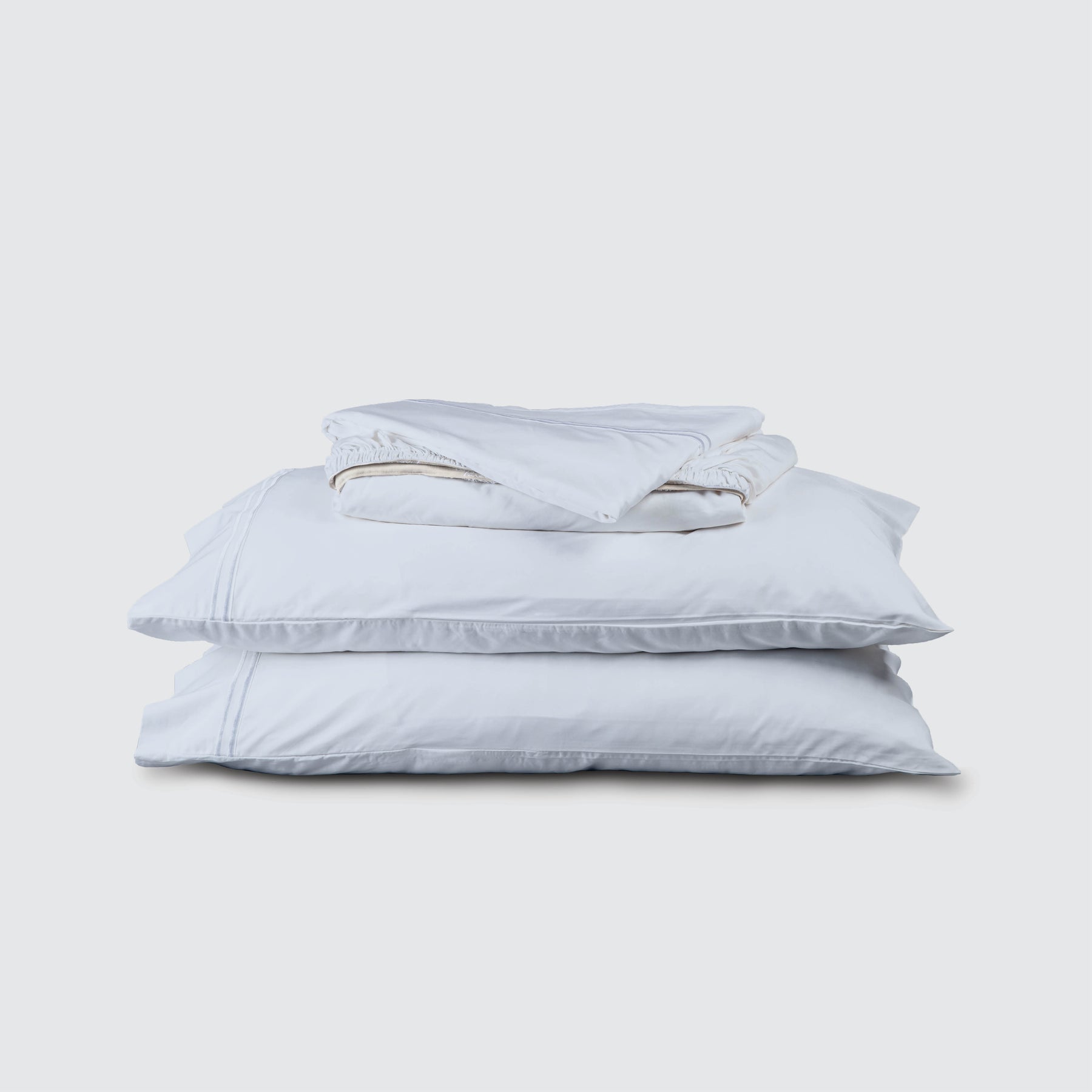 Image of Light Blue Soft Touch TENCEL™ Modal Sheet Set stacked top to bottom: Flat Sheet, Fitted Sheet, 2 Pillowcases