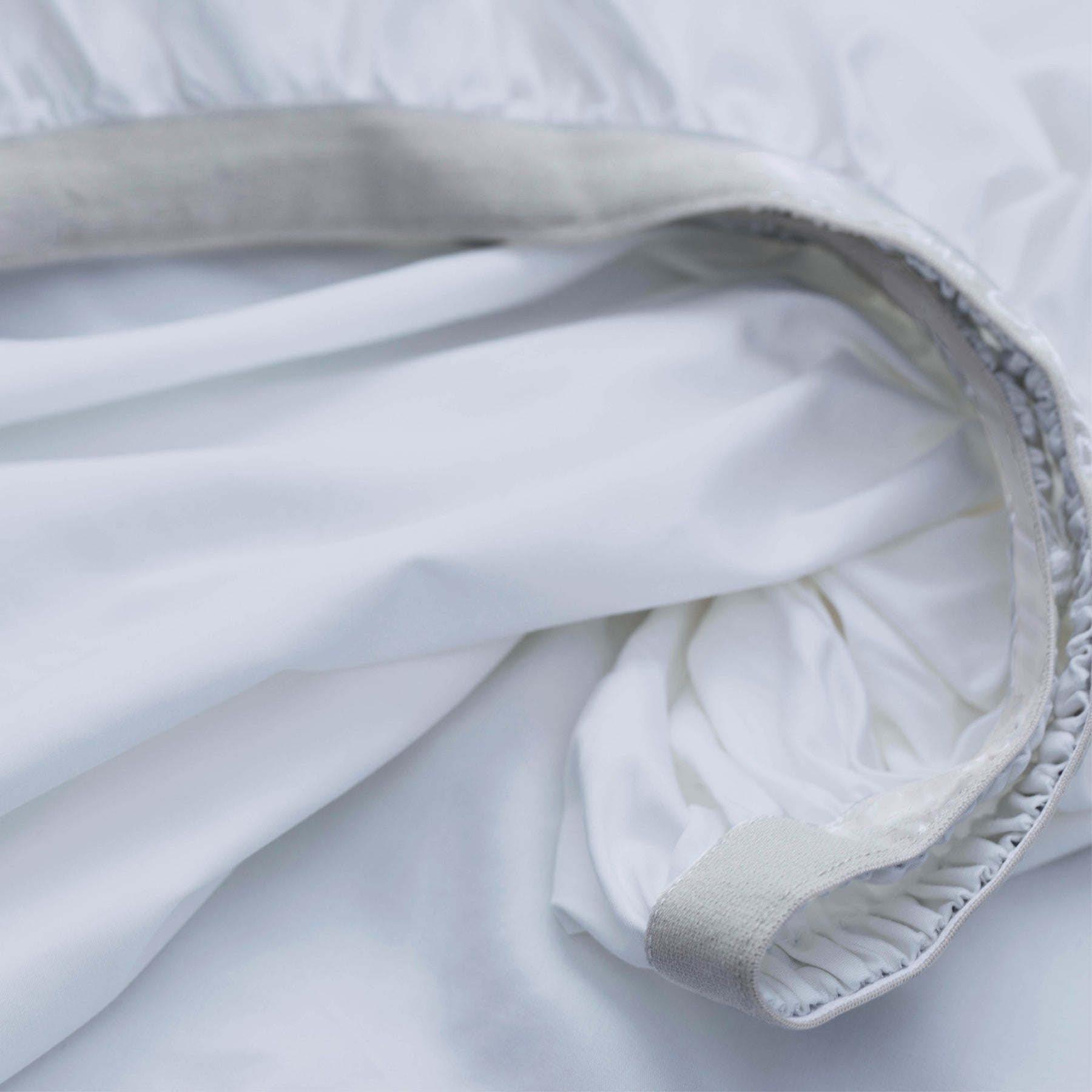 Image showcasing the Precision-Fit® elastic band on the bottom of a Light Blue Soft Touch TENCEL™ Modal fitted sheet