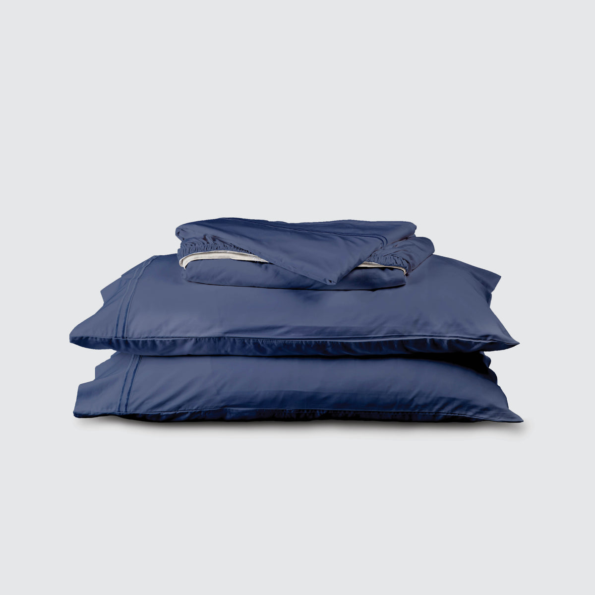 Image of Midnight Soft Touch TENCEL™ Modal Sheet Set stacked top to bottom: Flat Sheet, Fitted Sheet, 2 Pillowcases