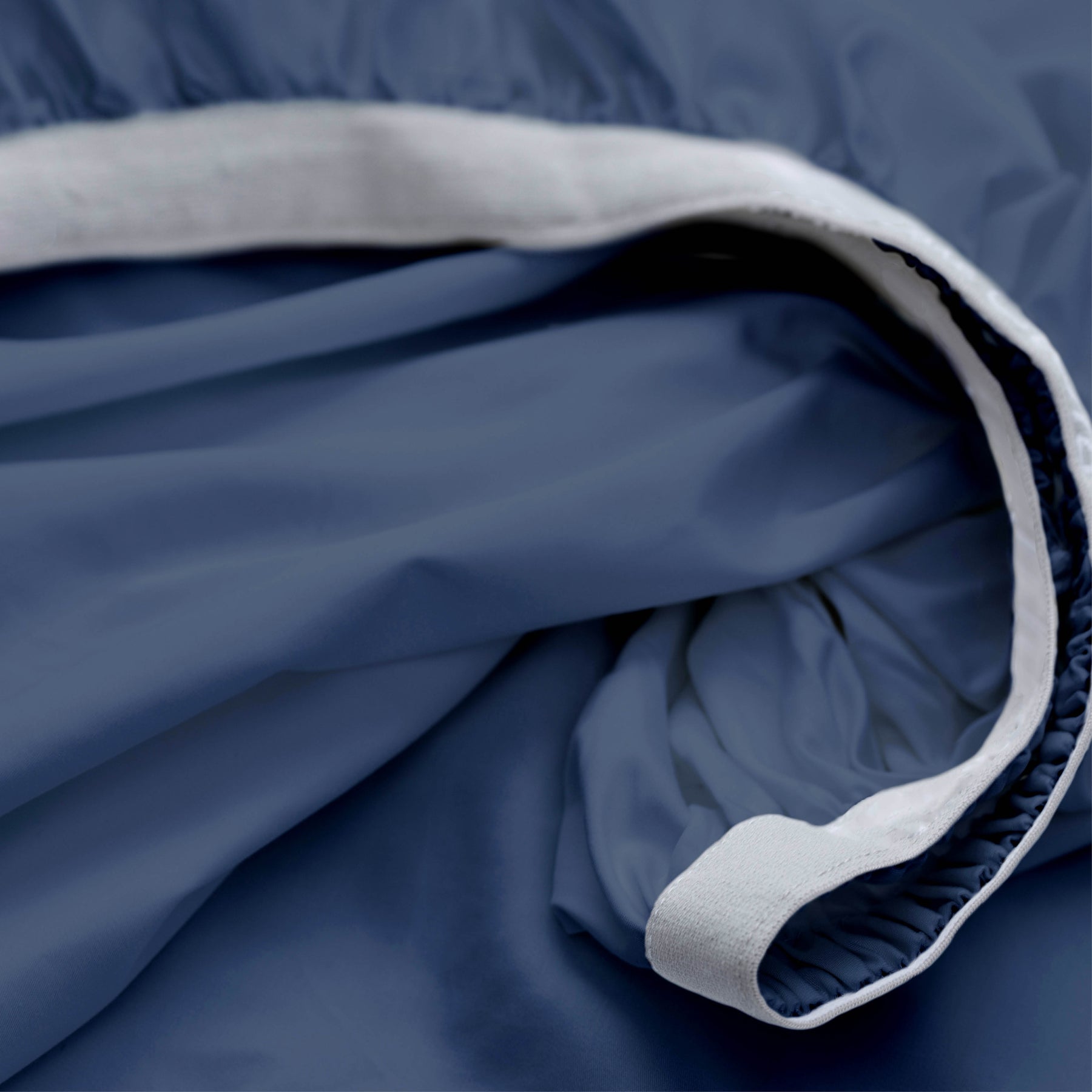 Image showcasing the Precision-Fit® elastic band on the bottom of a Midnight Soft Touch TENCEL™ Modal fitted sheet