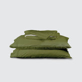 Image of Moss Soft Touch TENCEL™ Modal Sheet Set stacked top to bottom: Flat Sheet, Fitted Sheet, 2 Pillowcases