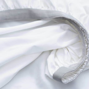 Image showcasing the Precision-Fit® elastic band on the bottom of a White Soft Touch TENCEL™ Modal fitted sheet