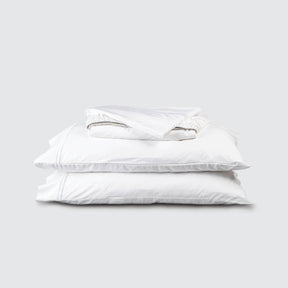 Image of White Soft Touch TENCEL™ Modal Sheet Set stacked top to bottom: Flat Sheet, Fitted Sheet, 2 Pillowcases